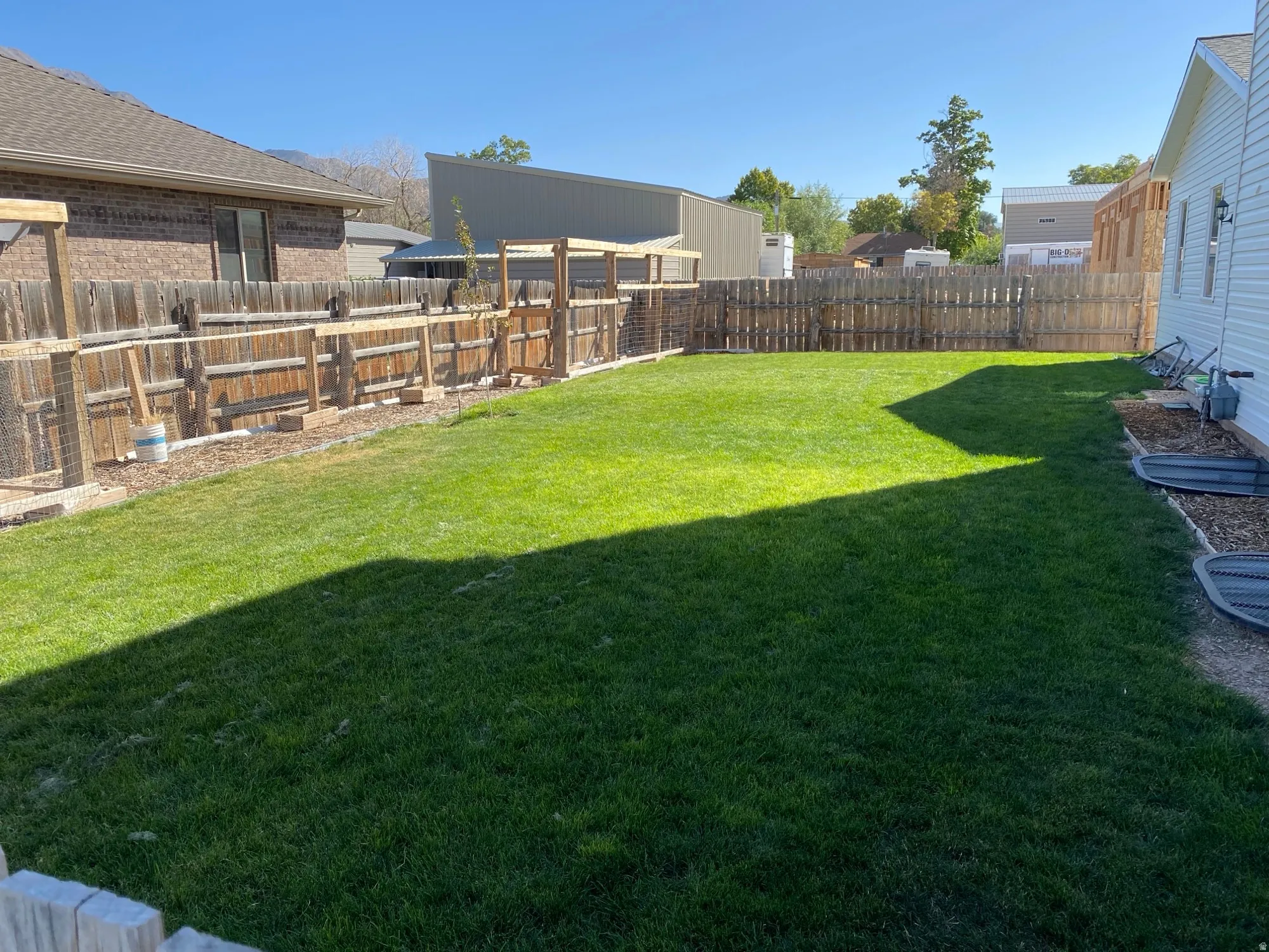 View of fenced backyard
