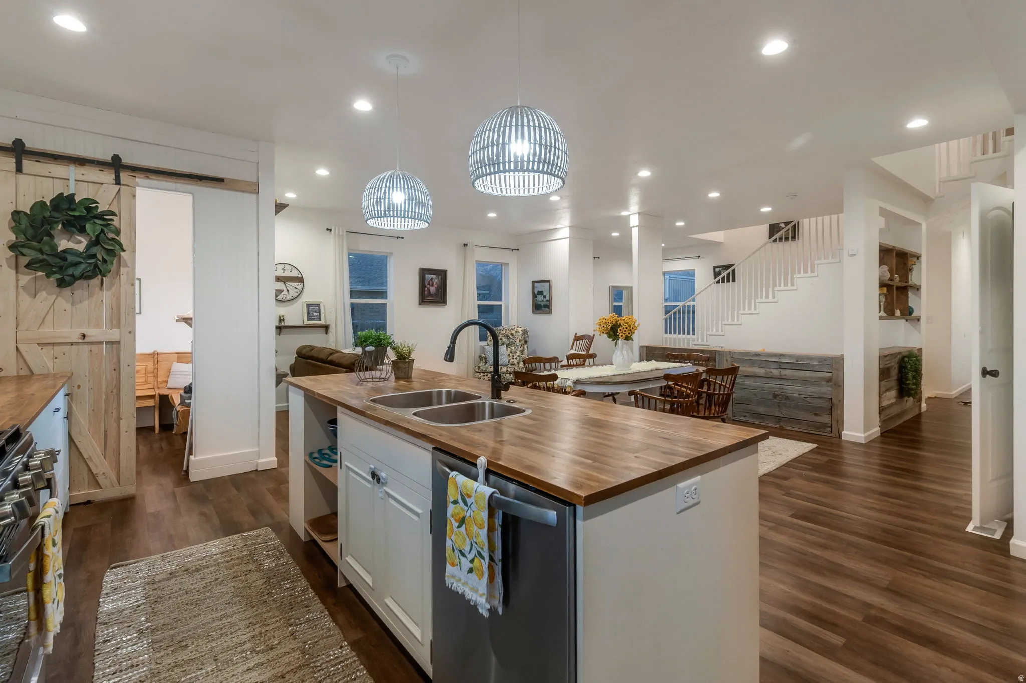 Kitchen with butcher block countertops, a 4'5" island with sink.