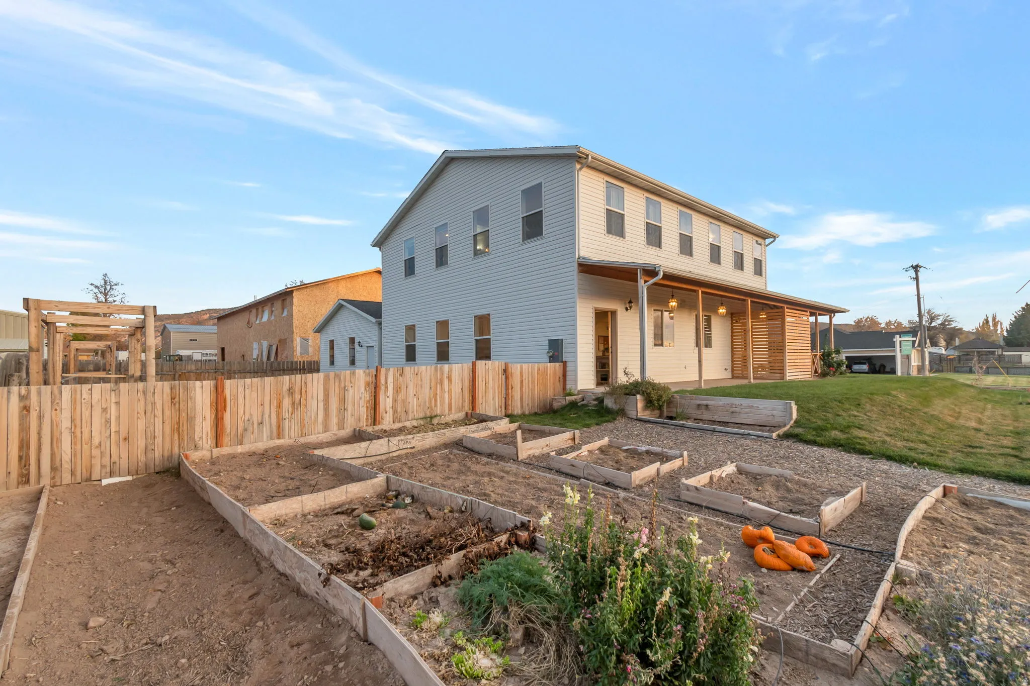 Side View of home featuring a vegetable garden