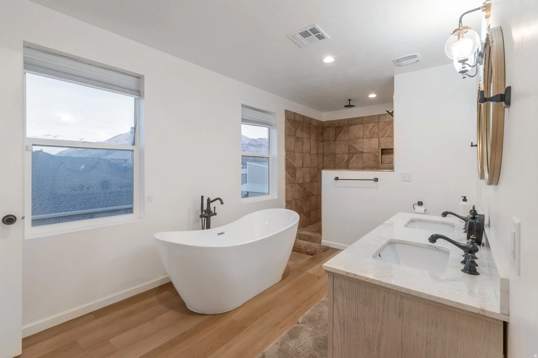 Master Bathroom with walk in shower and soaking tub.