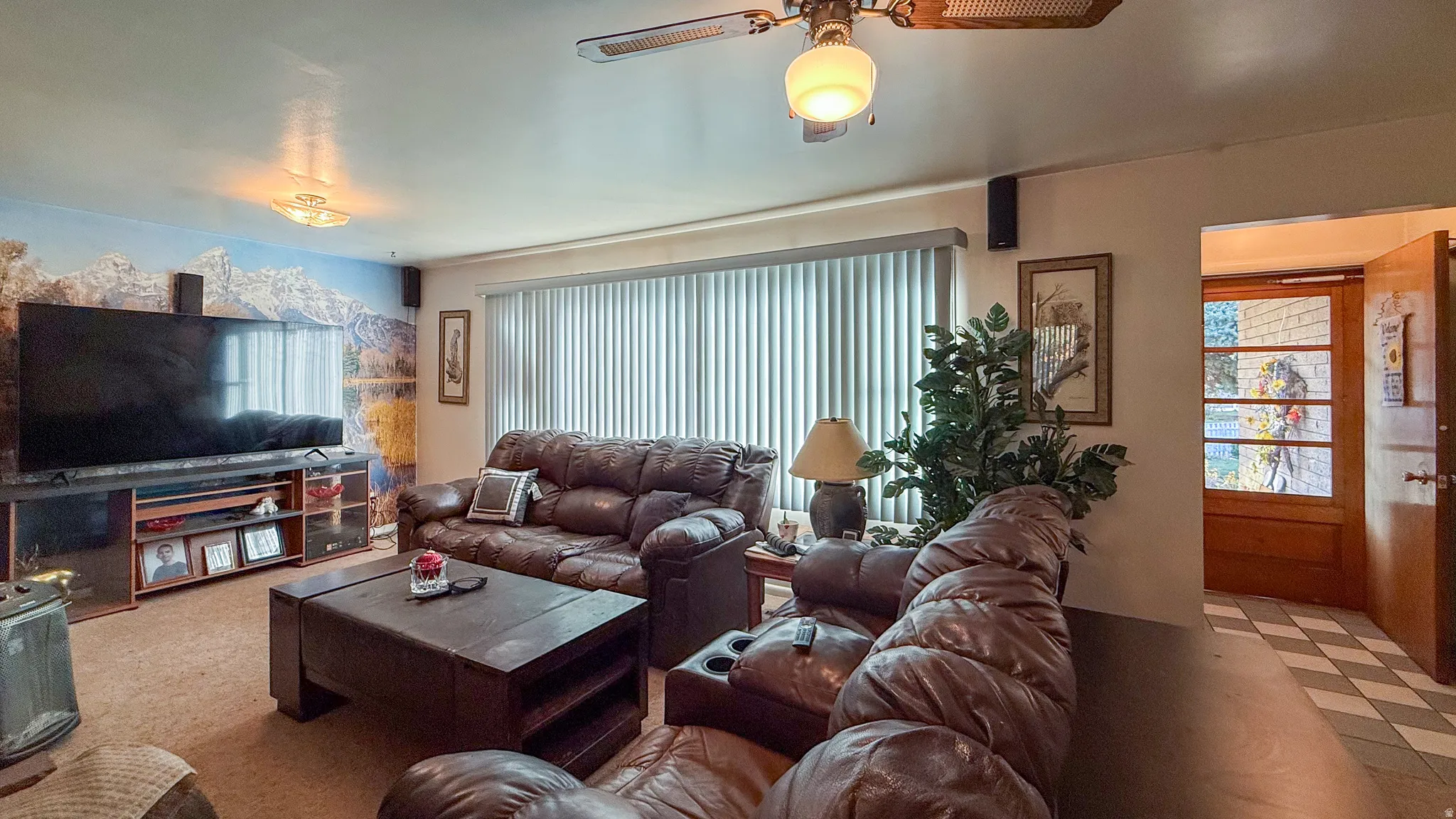 Living room featuring ceiling fan