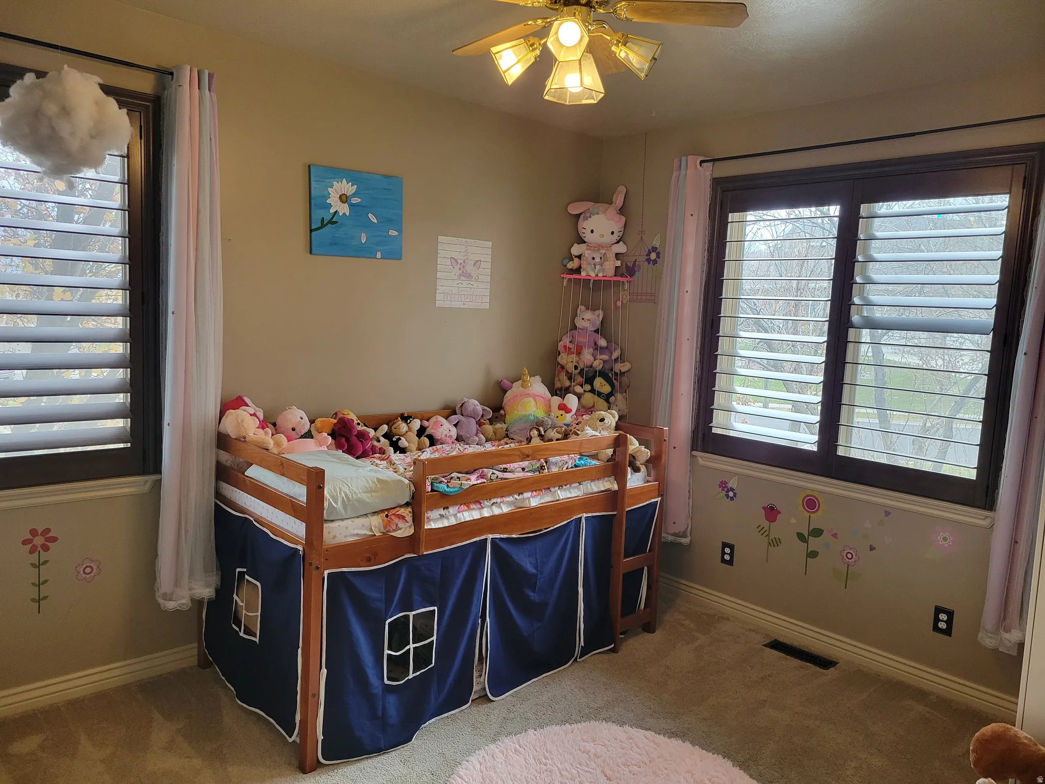 Bedroom with carpet flooring and ceiling fan