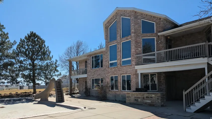 View of property with stairs