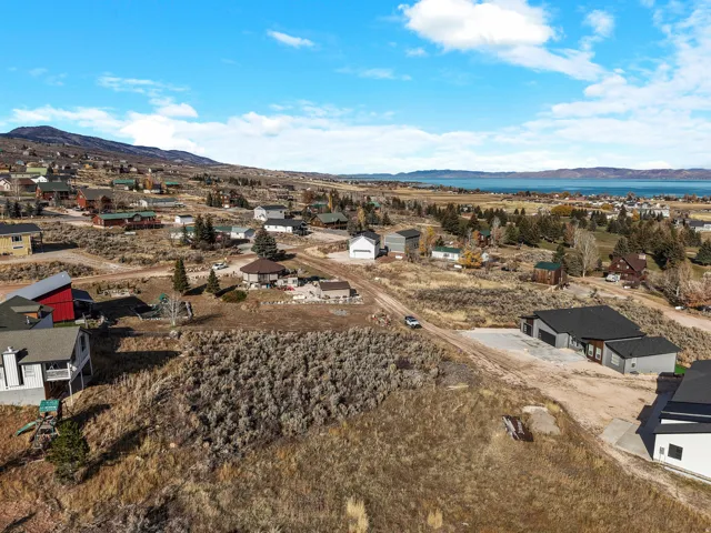 Aerial view of residential area featuring a mountainous background