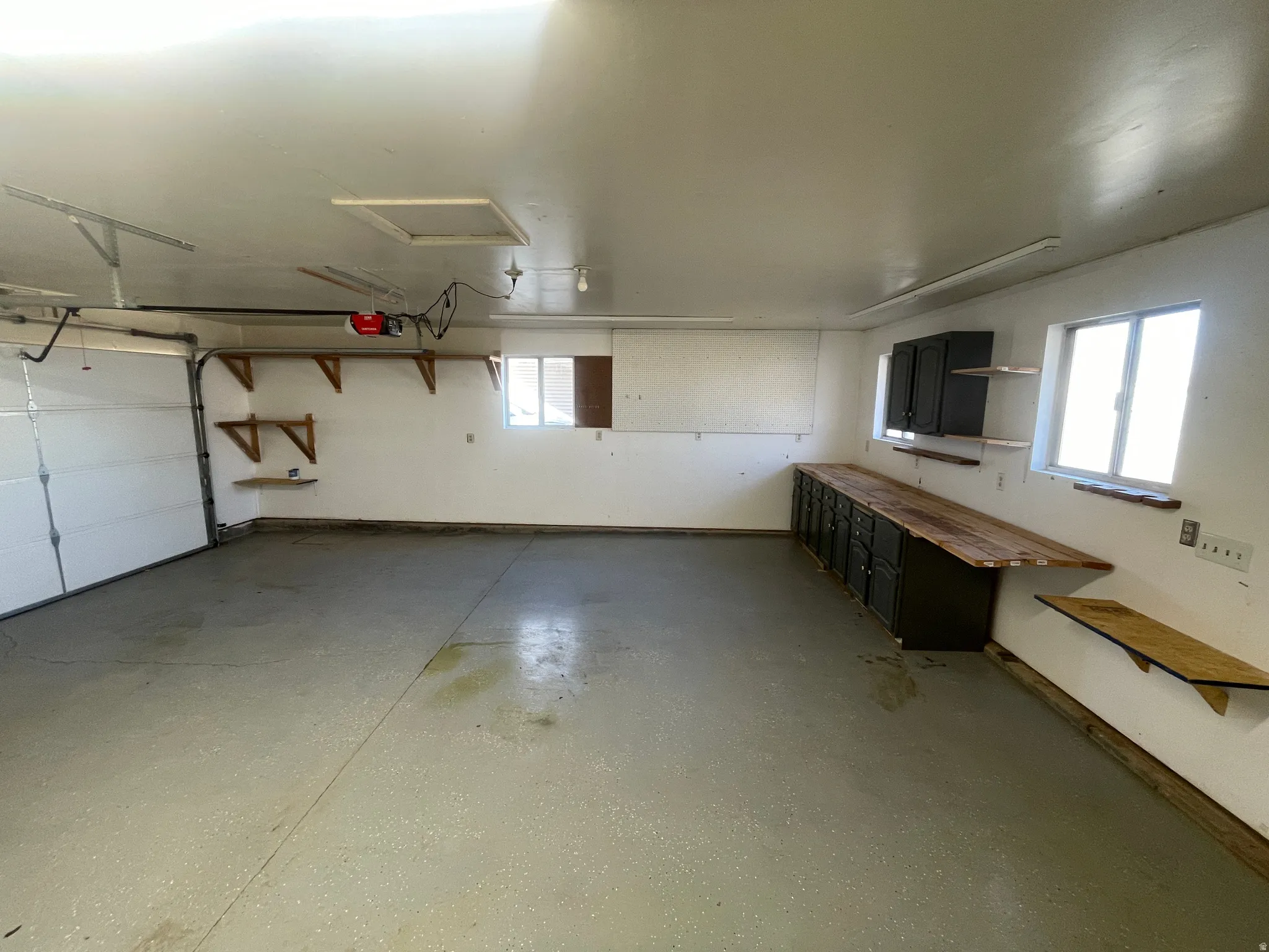 Garage featuring a garage door opener