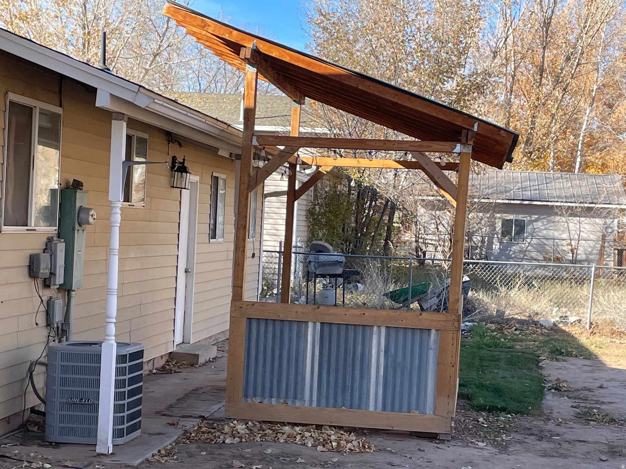 Wooden terrace featuring a grill