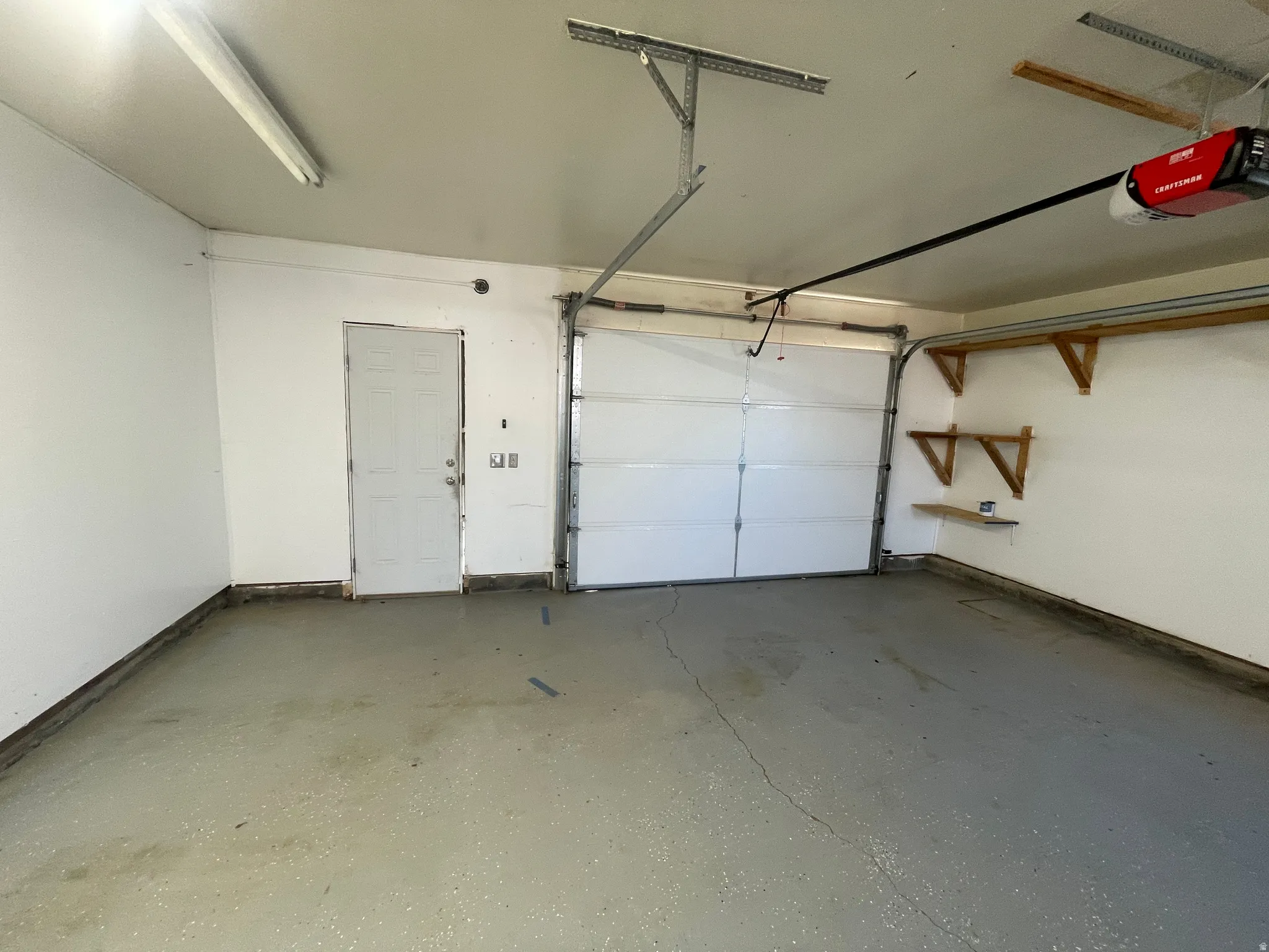 Garage featuring a garage door opener