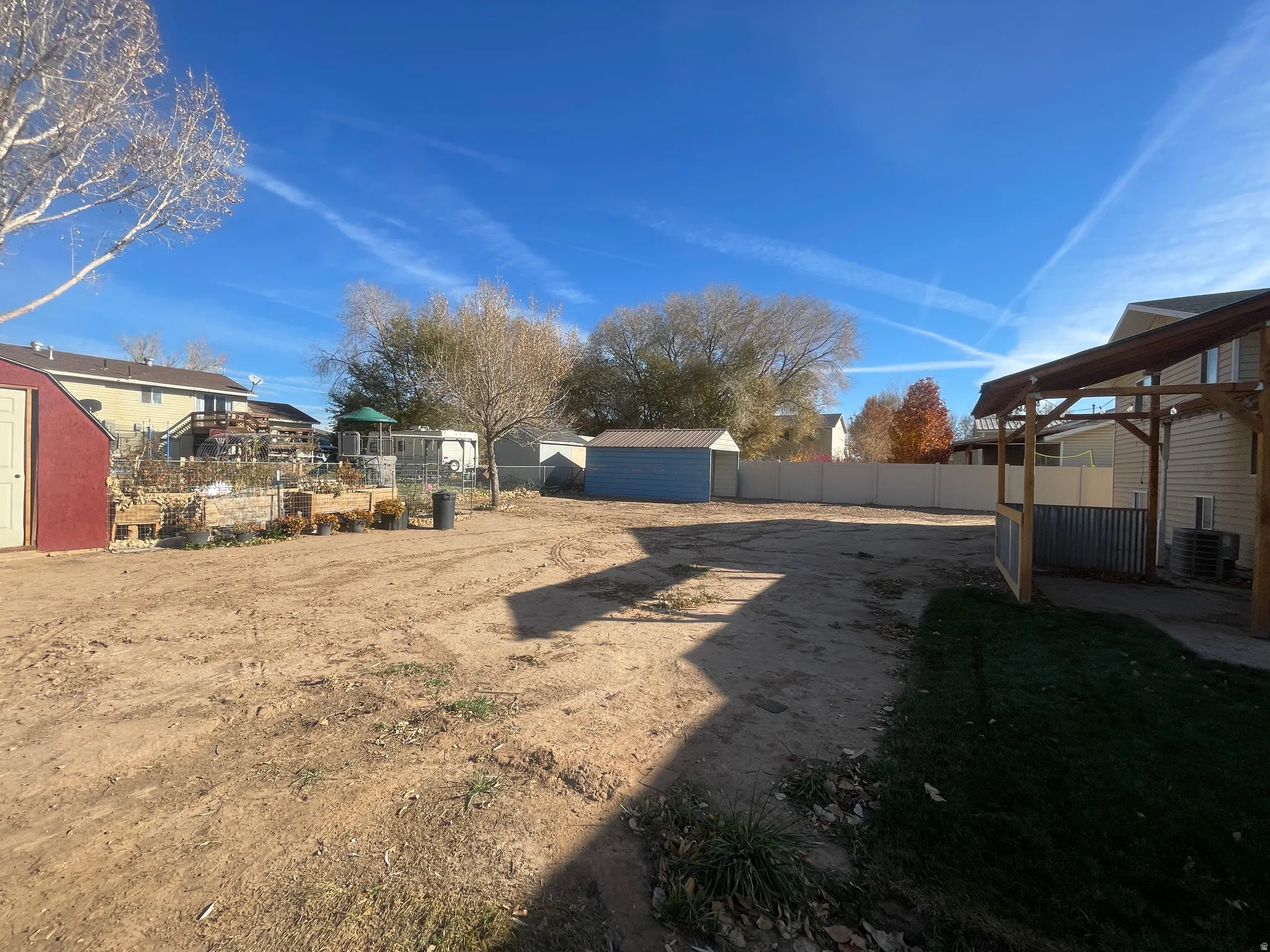 View of yard with a shed and a patio