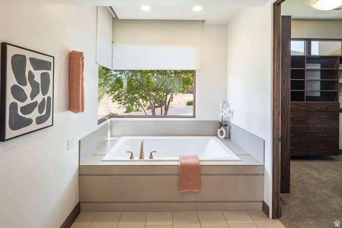 Full bath with a garden tub, recessed lighting, and light tile patterned floors
