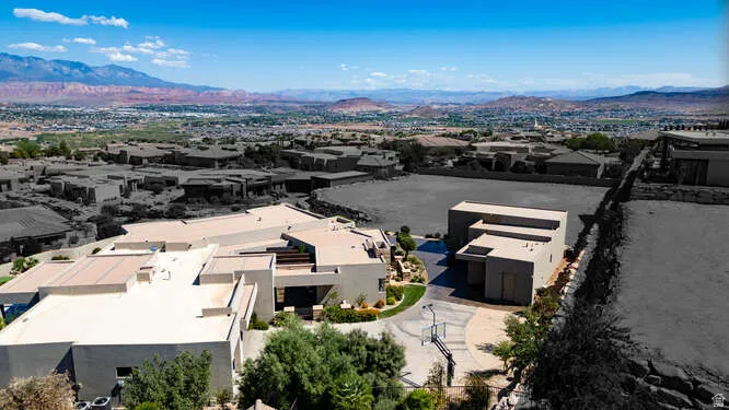 Aerial view of residential area featuring a mountain backdrop