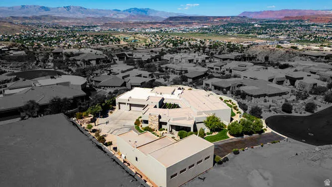 Aerial view of residential area featuring a mountainous background