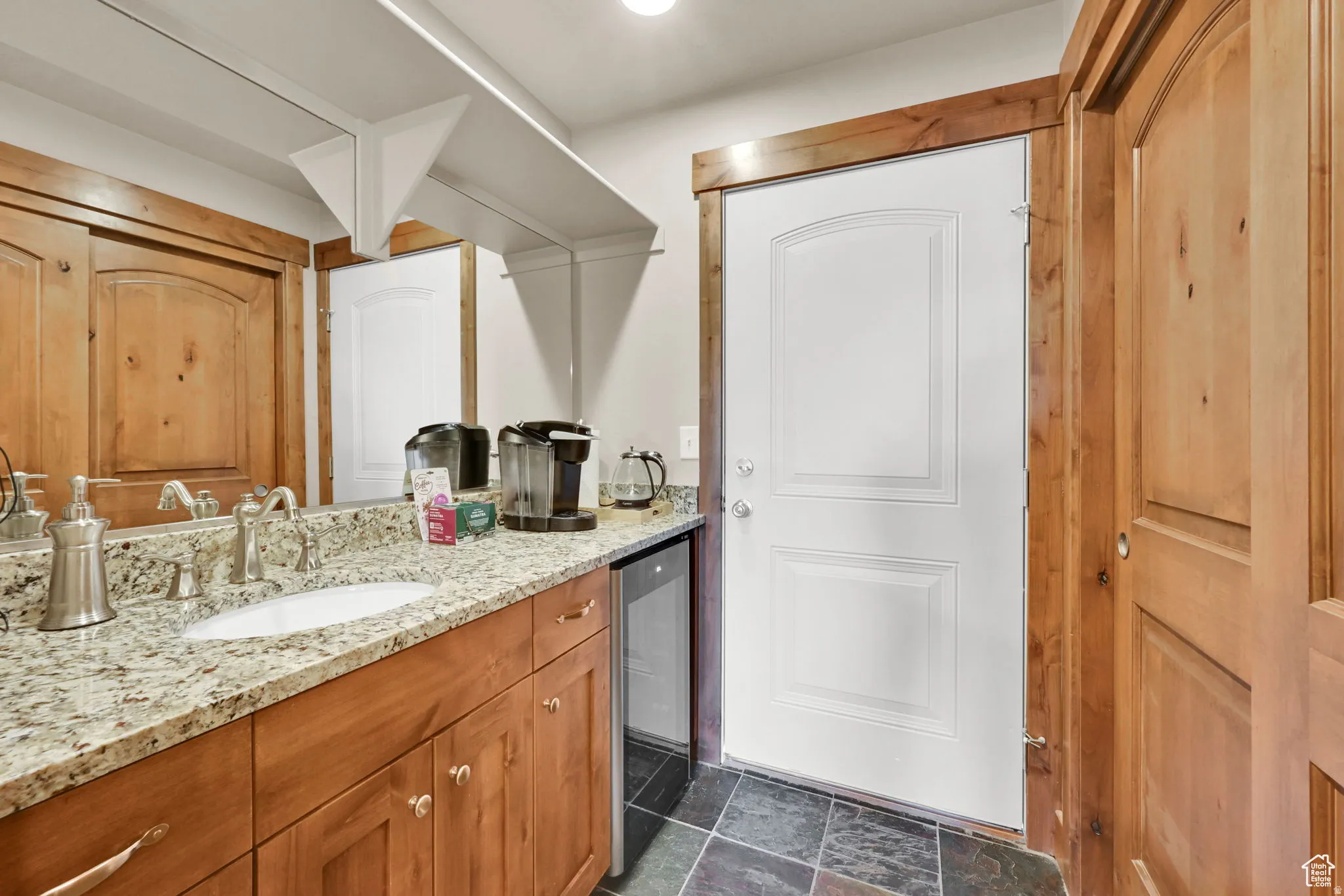 Bathroom featuring vanity and wine cooler