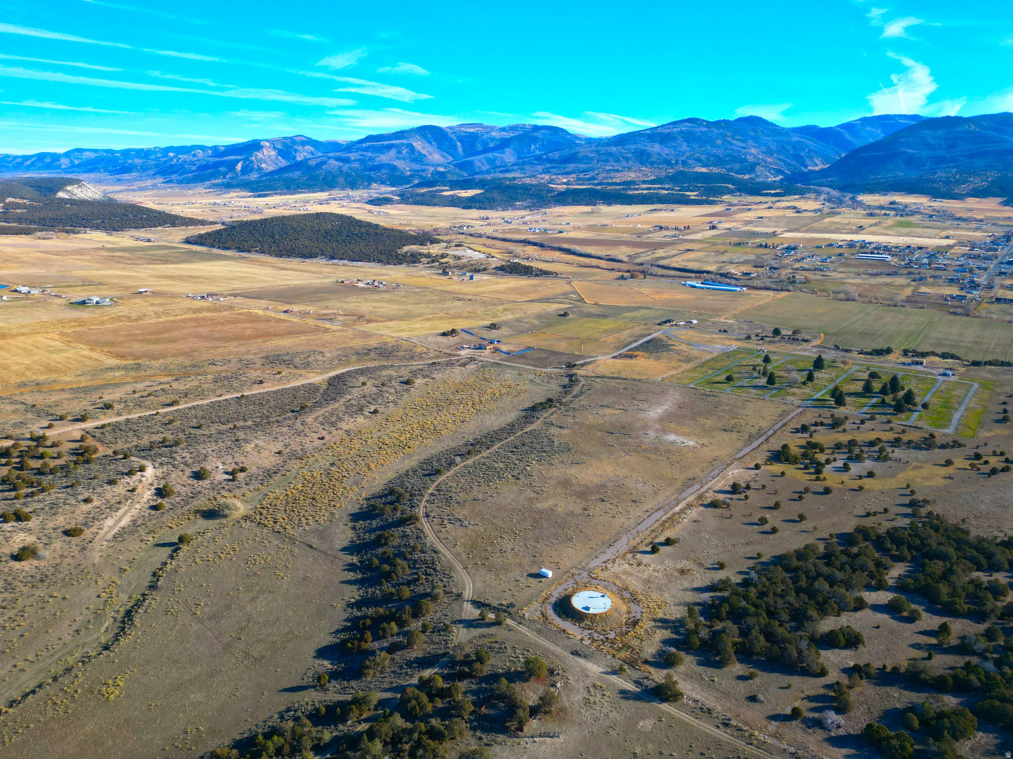 Aerial view of sparsely populated area with a mountain backdrop