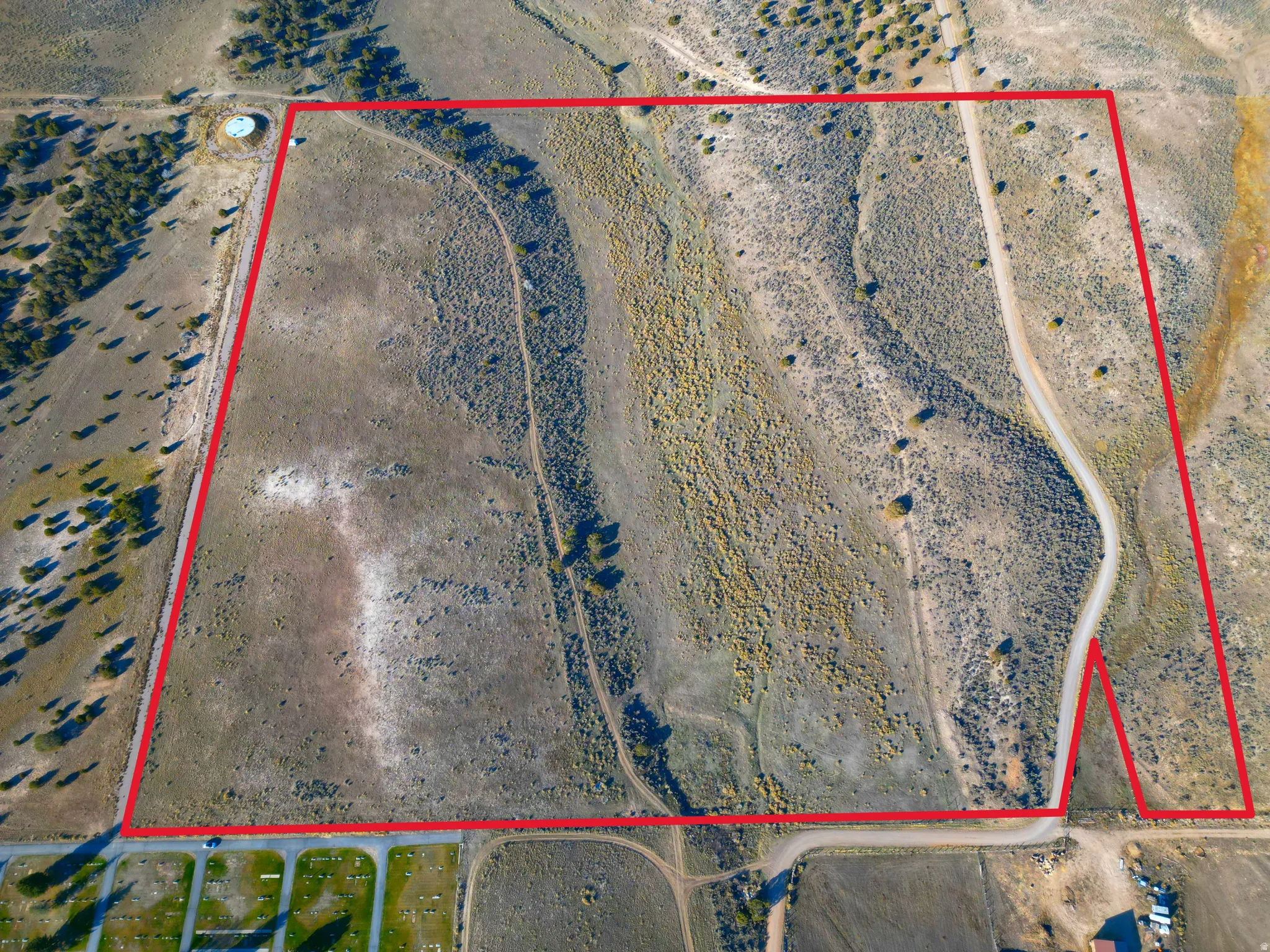 Aerial view of sparsely populated area featuring APPROXIMATE property boundaries highlighted
