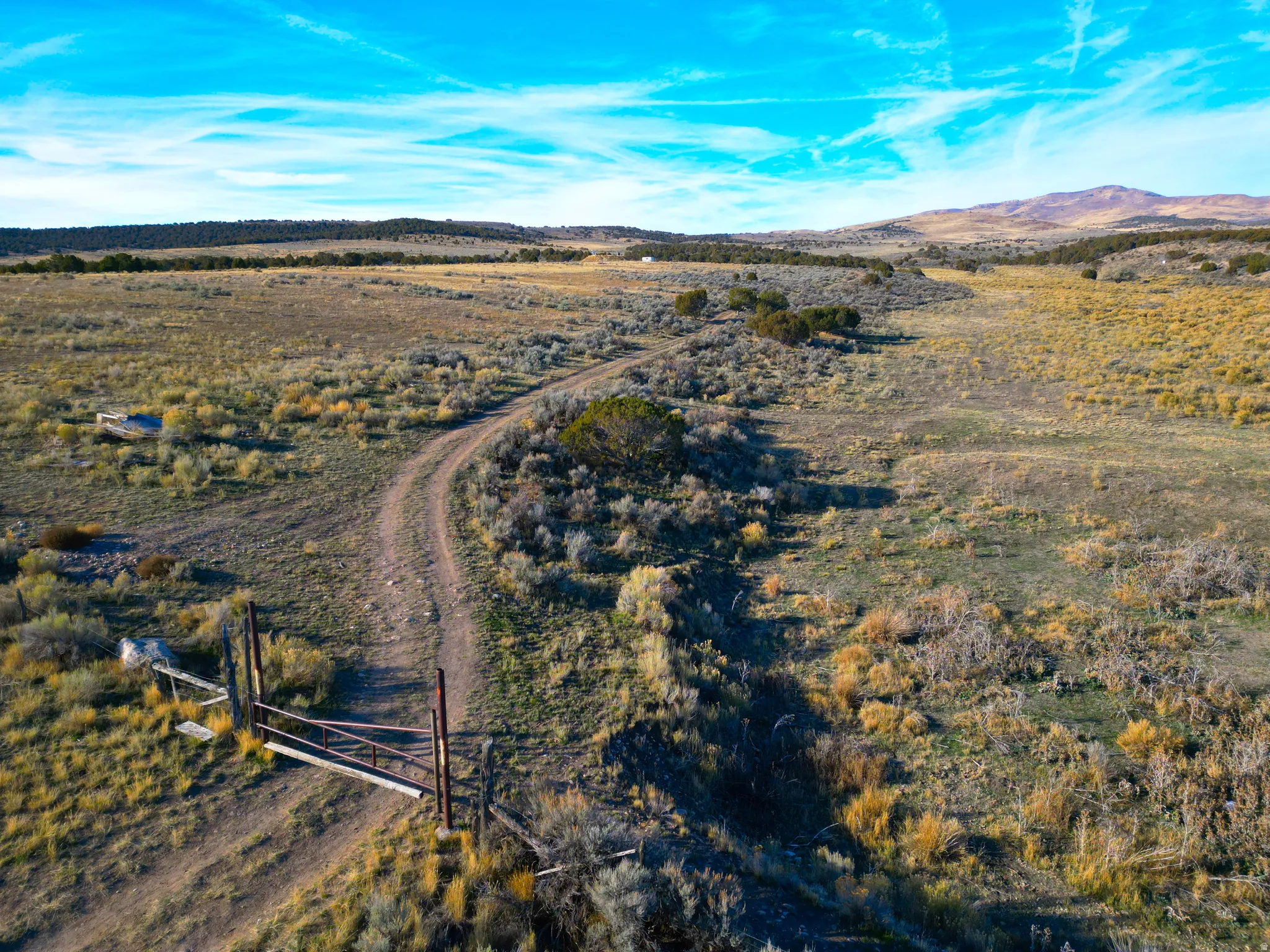 Aerial overview of property's location featuring rural landscape and a mountain backdrop