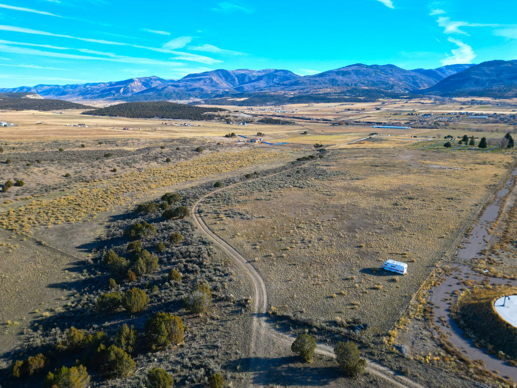 Overview of rural landscape featuring a mountainous background