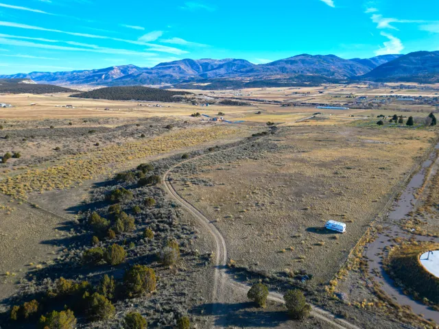 Overview of rural landscape featuring a mountainous background