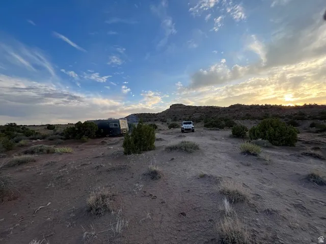 View of yard with a mountain view and view of desert landscape