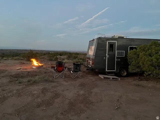View of outdoor structure with an outdoor fire pit