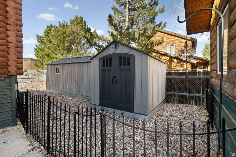 View of shed featuring a fenced backyard