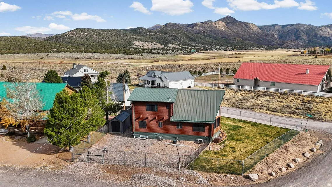 Aerial view of sparsely populated area featuring a mountain backdrop