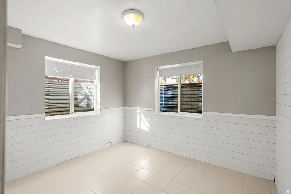 Spare room with a wainscoted wall and wooden walls