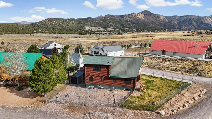 Aerial view of sparsely populated area featuring a mountain backdrop