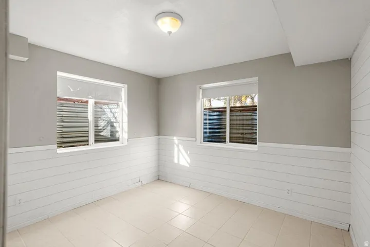 Spare room with a wainscoted wall and wooden walls
