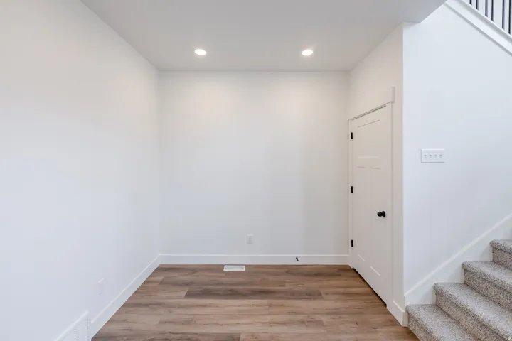 Spare room featuring light wood-style floors and recessed lighting