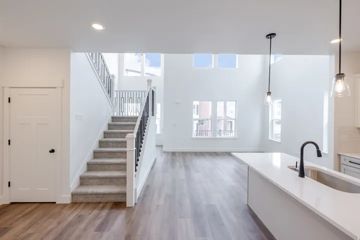 Unfurnished living room with dark wood-style floors and recessed lighting
