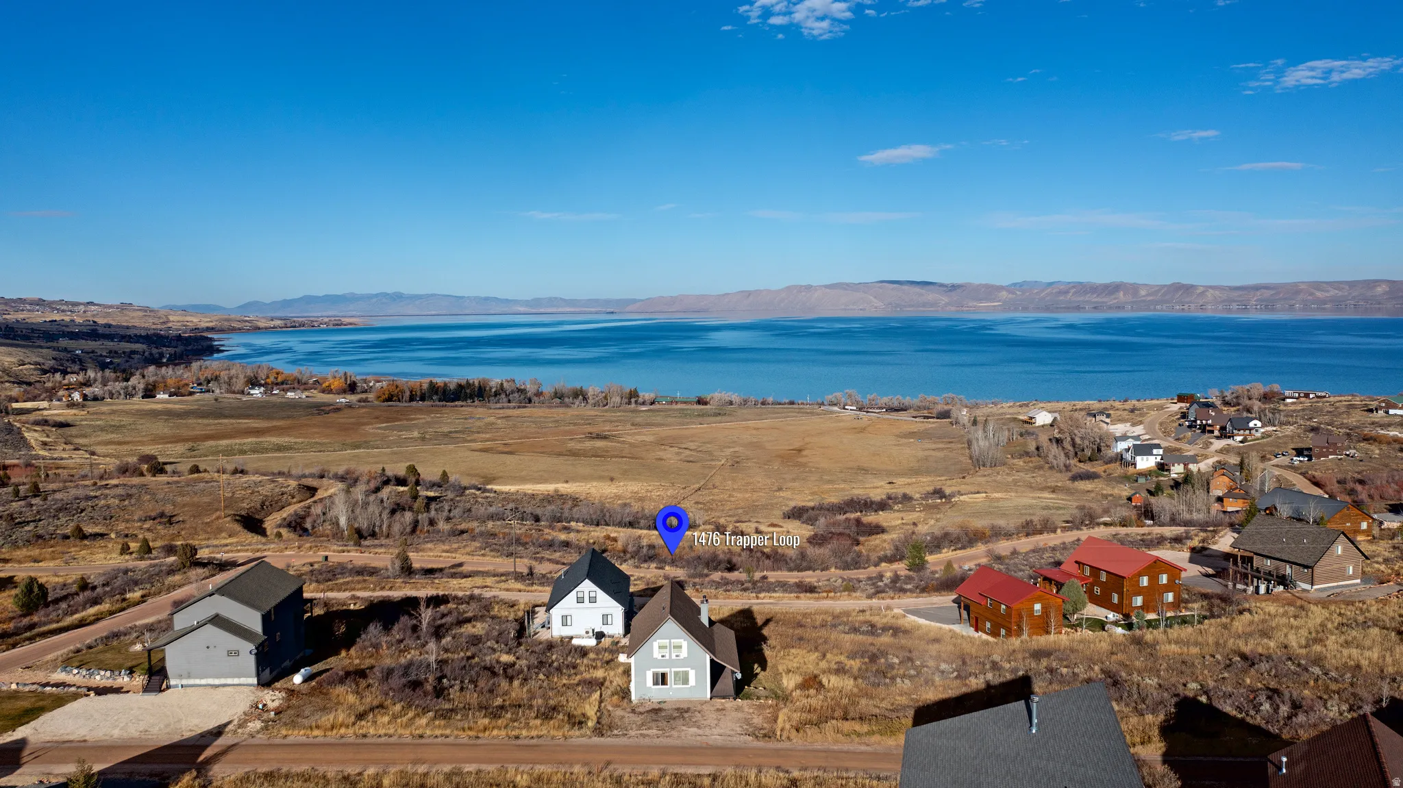 Aerial view of residential area with a water and mountain view