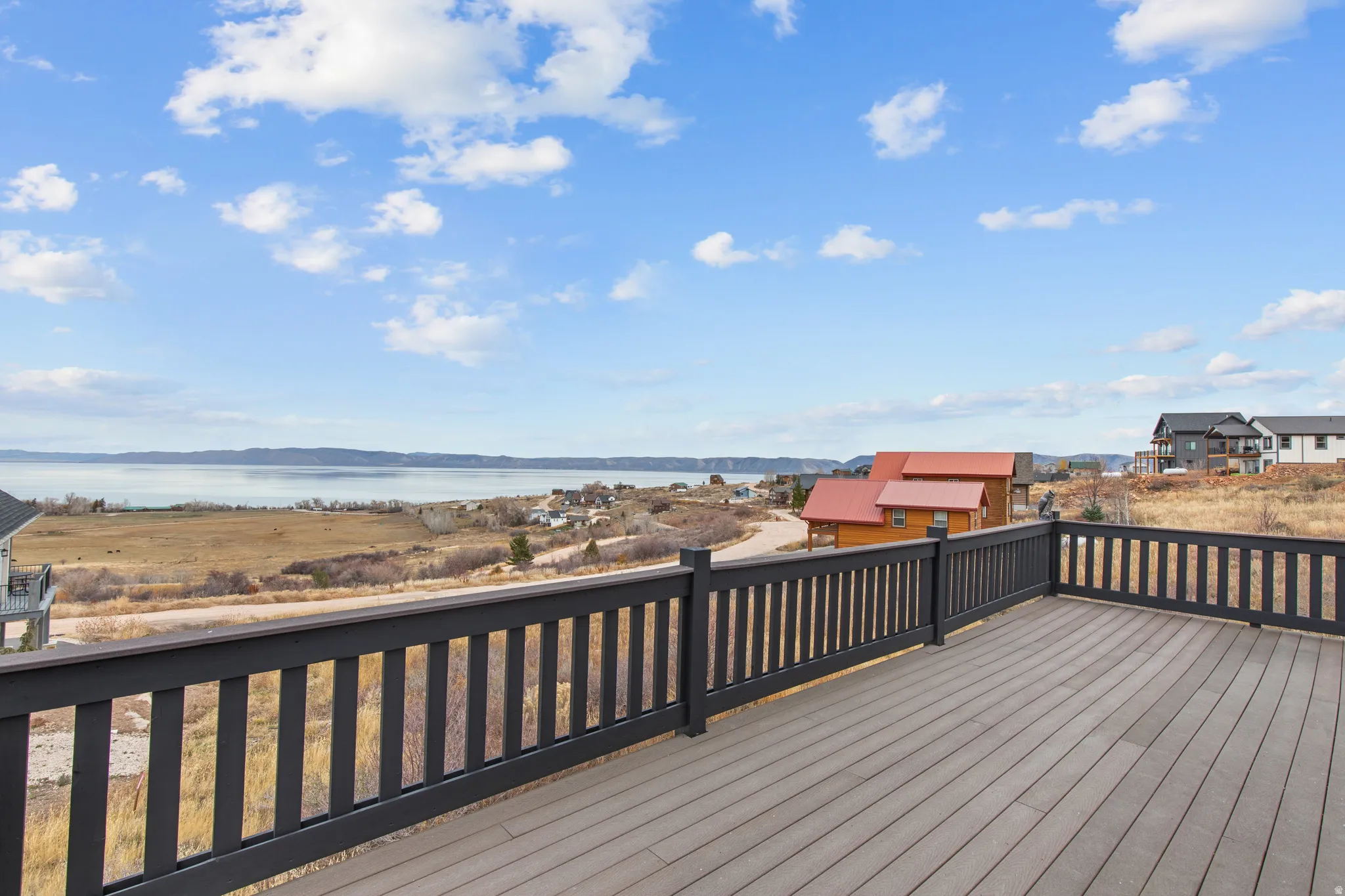 Wooden deck featuring a water view
