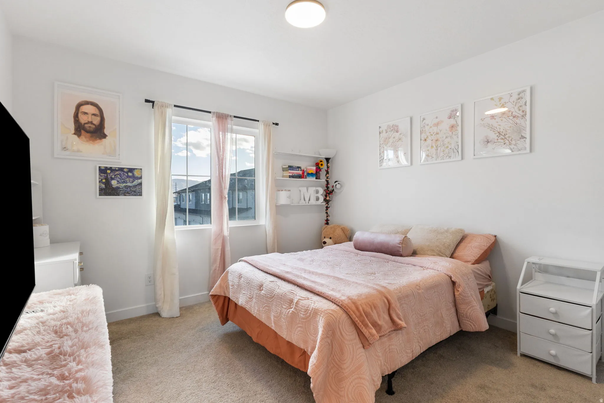 Carpeted bedroom with baseboards
