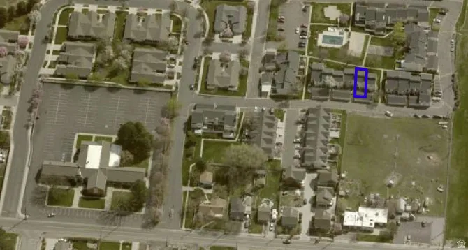 View of property location with nearby suburban area