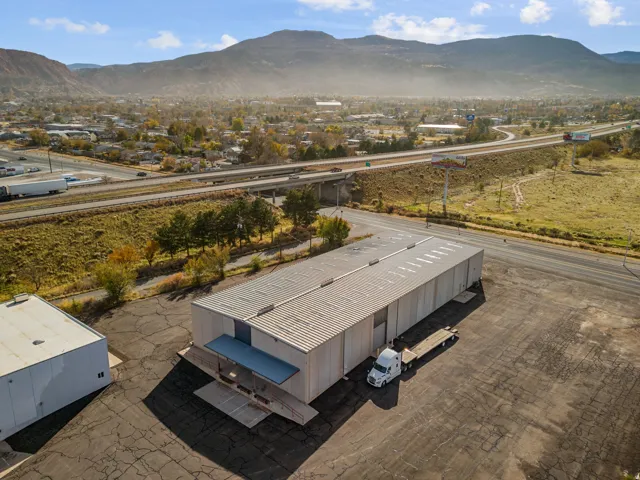 Drone / aerial view of mountains and a major roadway