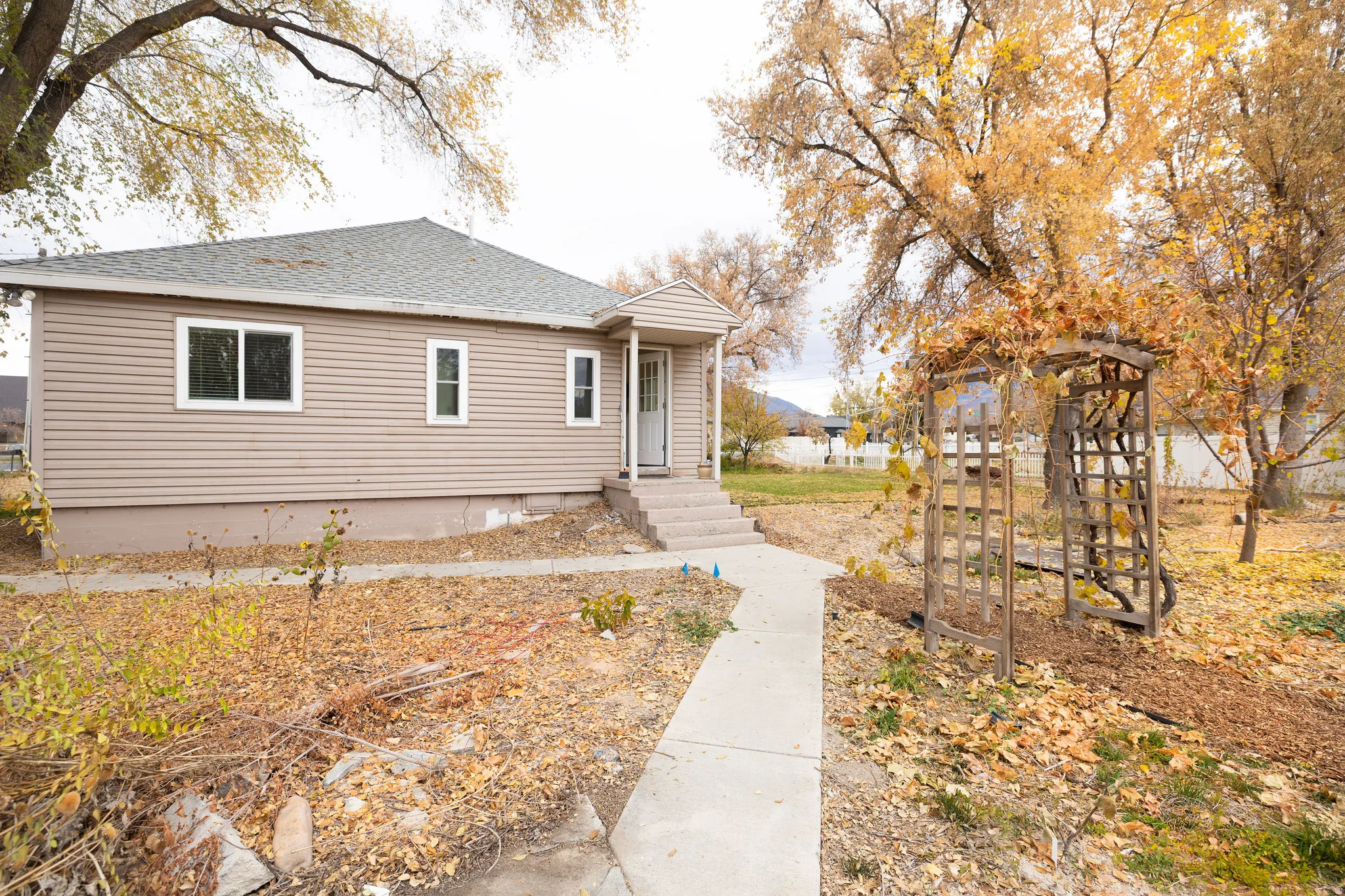View of side of property featuring roof with shingles