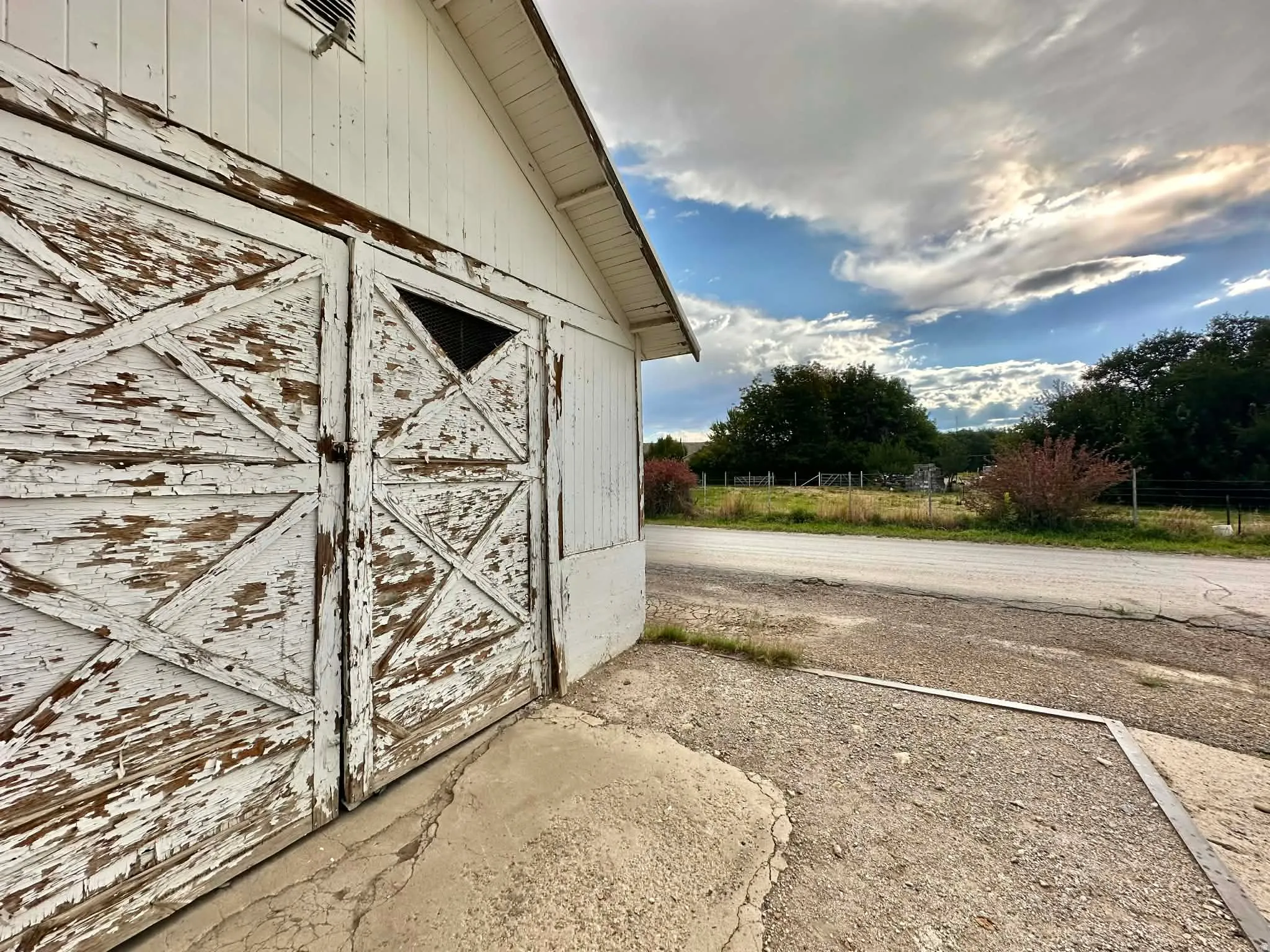 View of side of property featuring an outbuilding