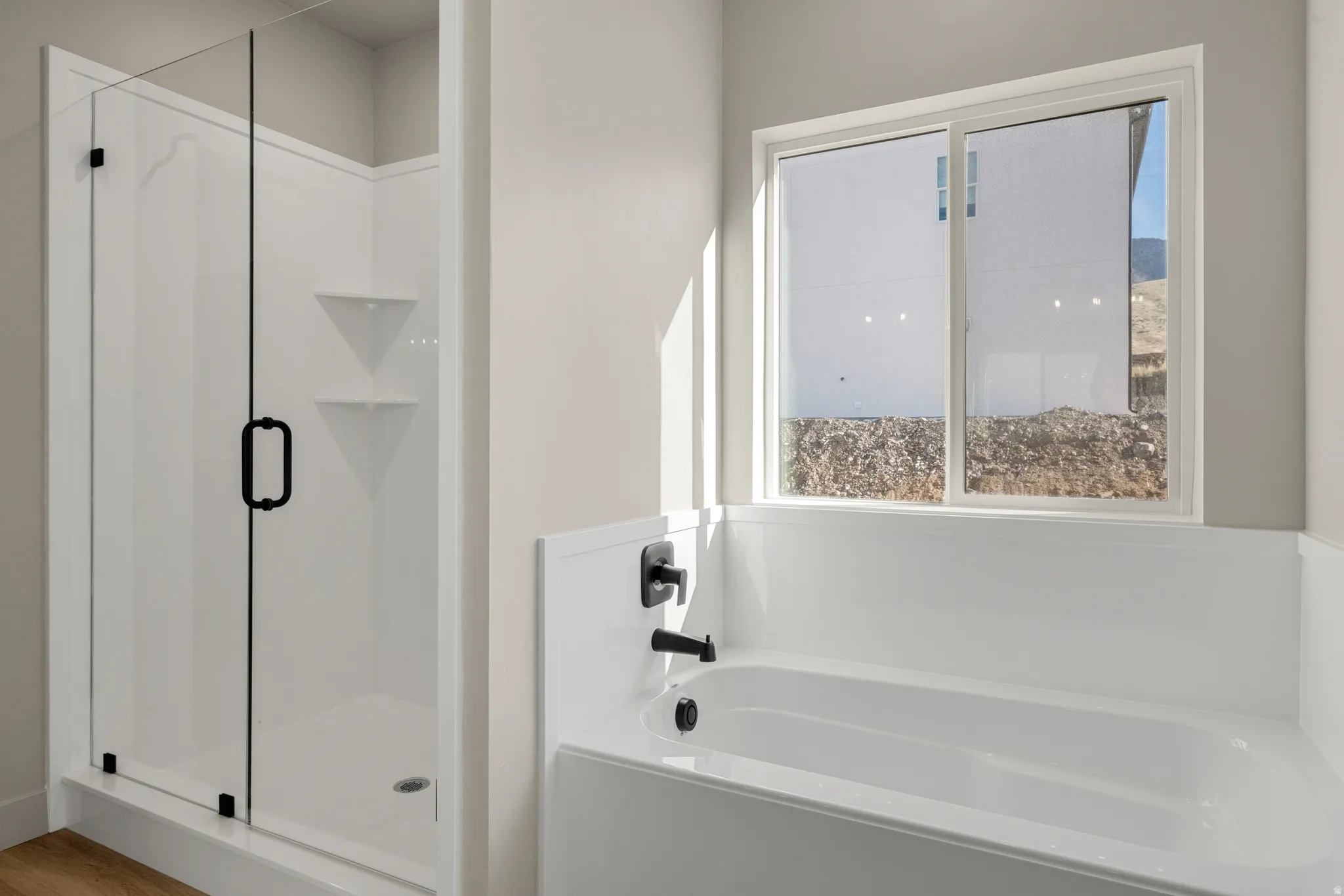 Bathroom with a garden tub and a shower stall