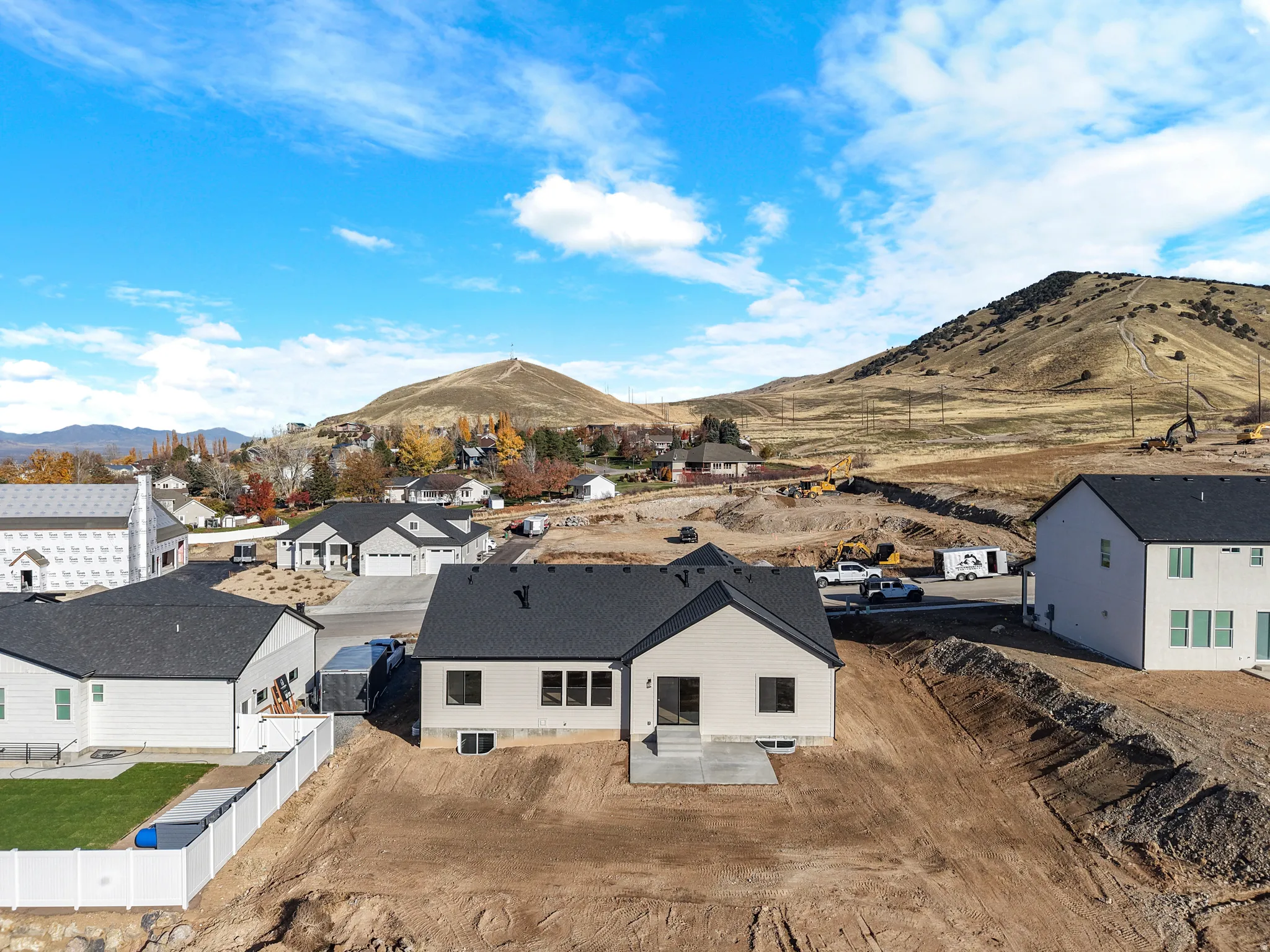 Aerial view of residential area featuring a mountain backdrop