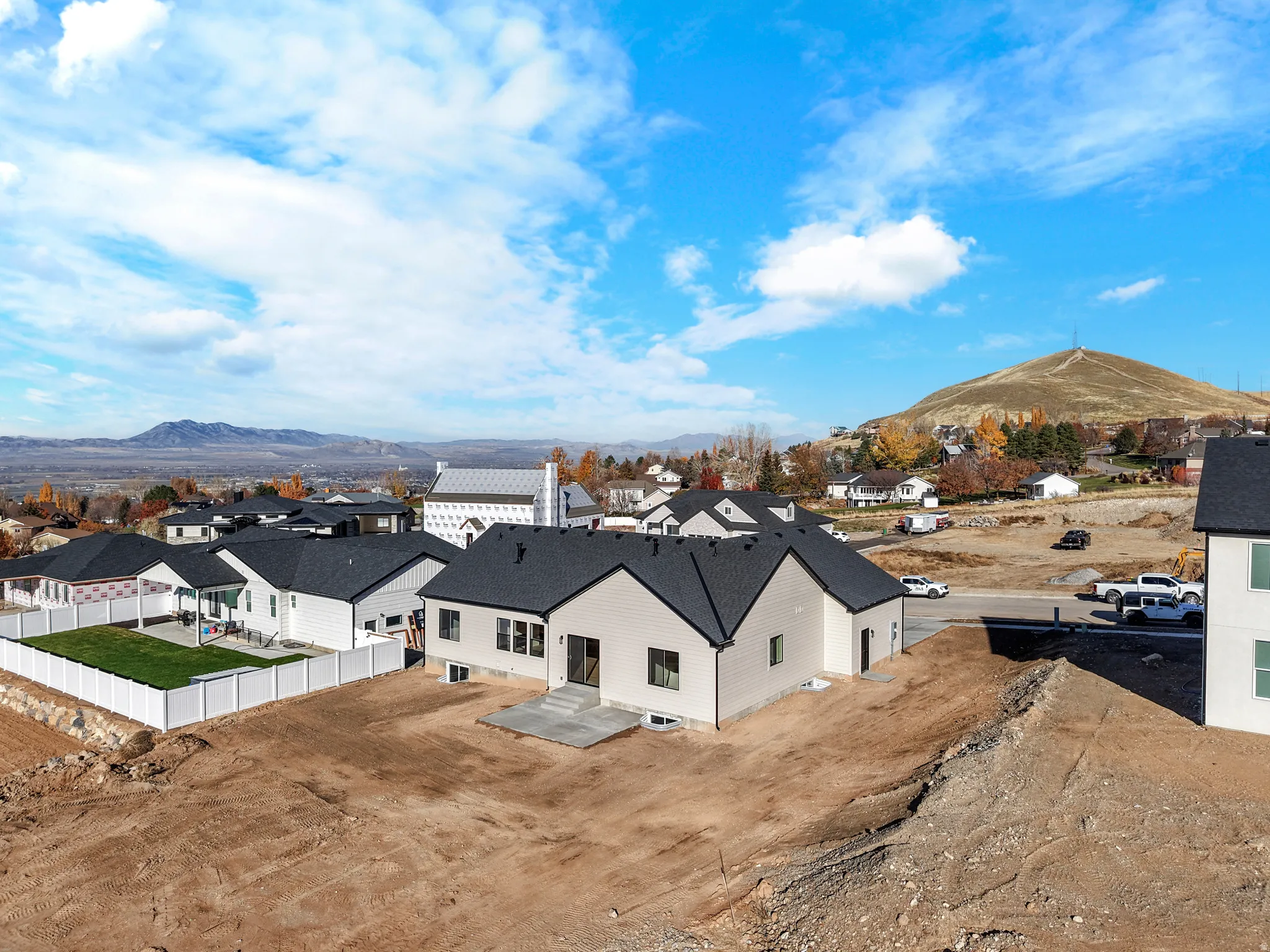 Aerial perspective of suburban area with a mountain backdrop