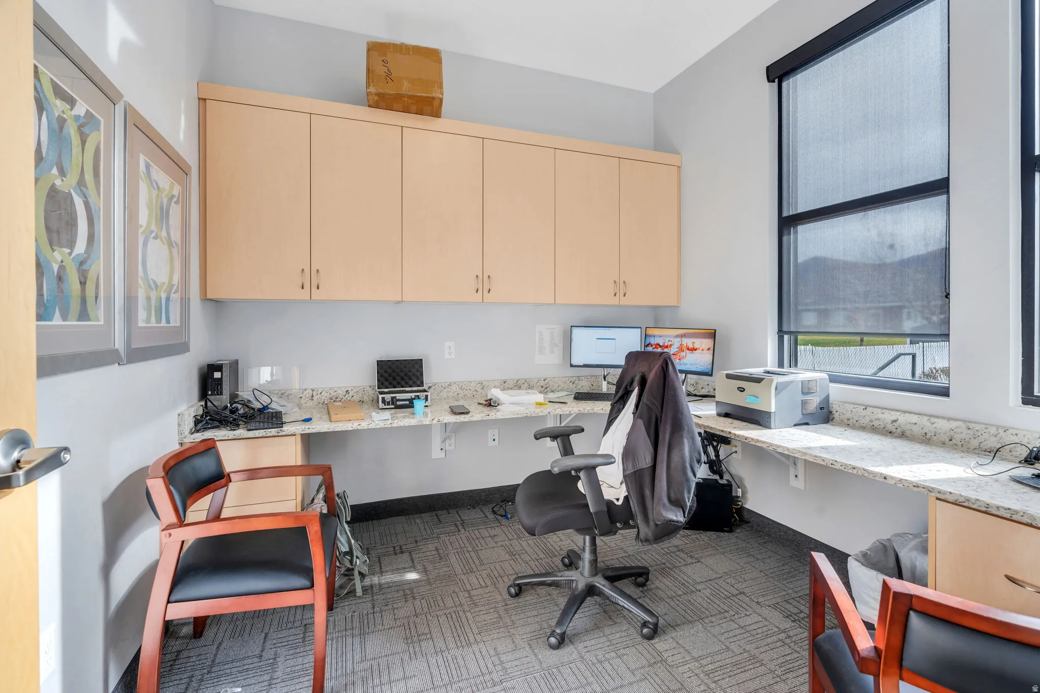 Home office featuring built in study area