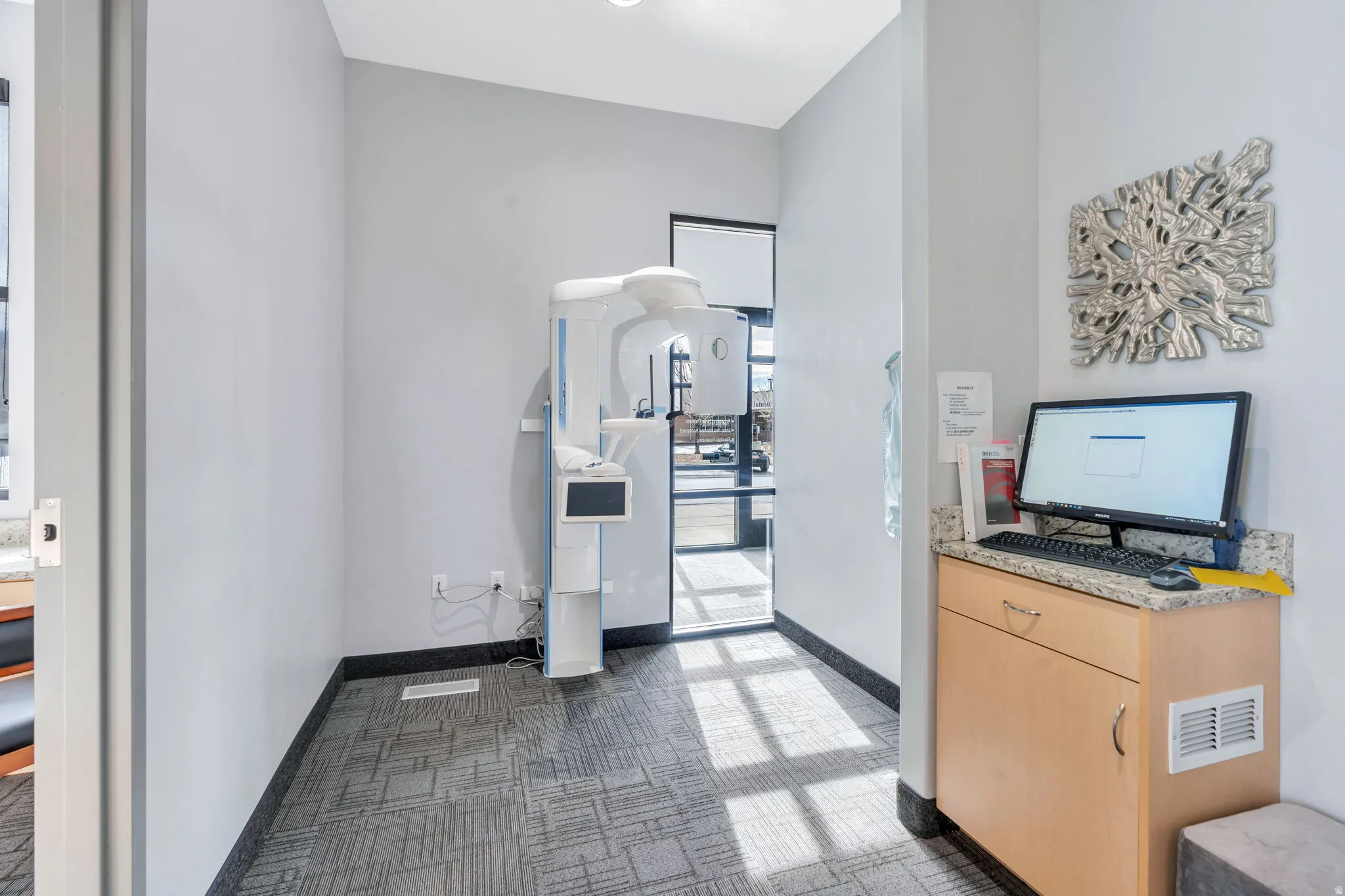 Office area featuring baseboards