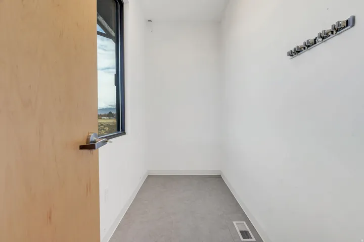 Empty room featuring baseboards