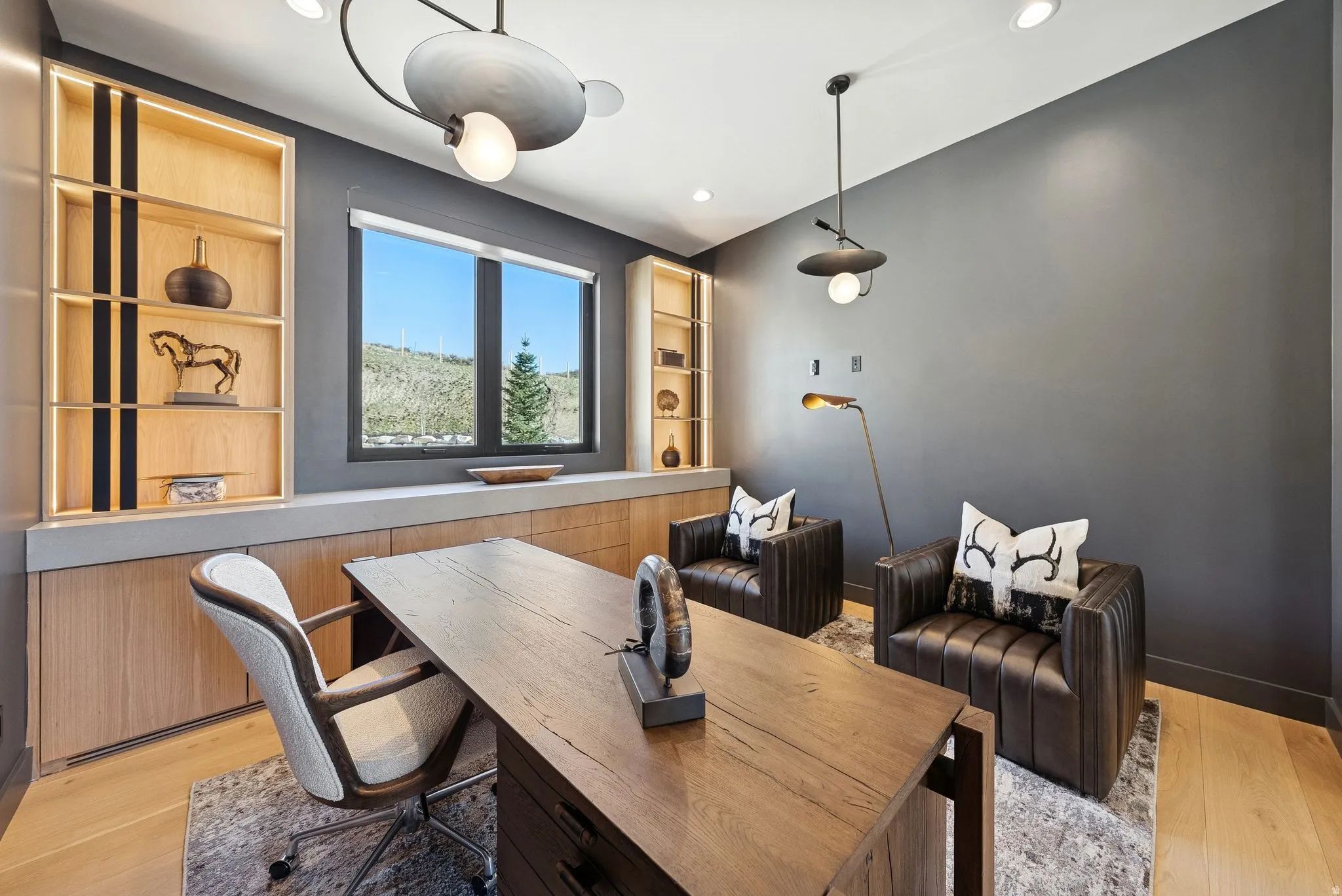 Home office featuring light wood-style flooring and recessed lighting