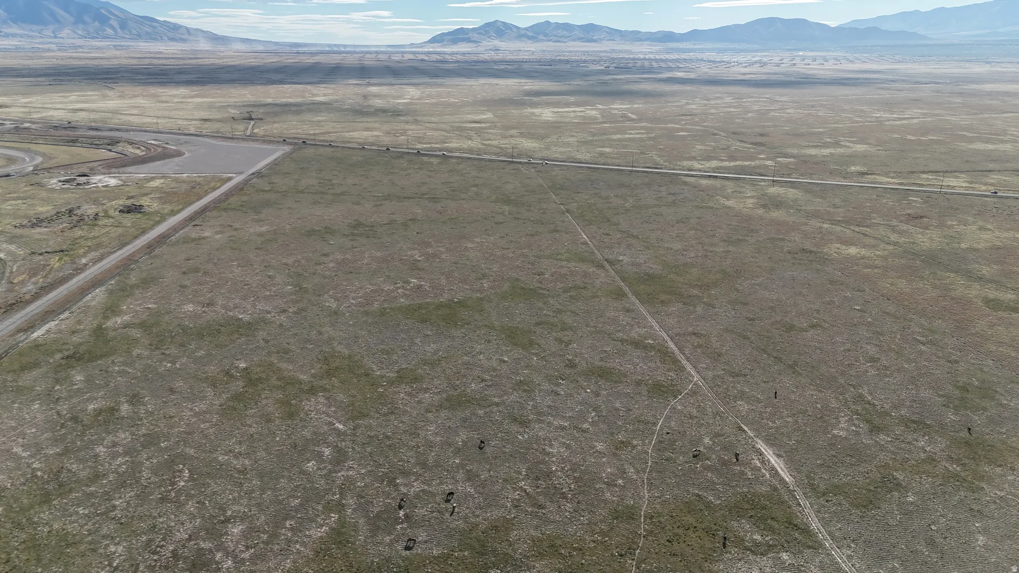 Overview of rural landscape featuring a mountainous background