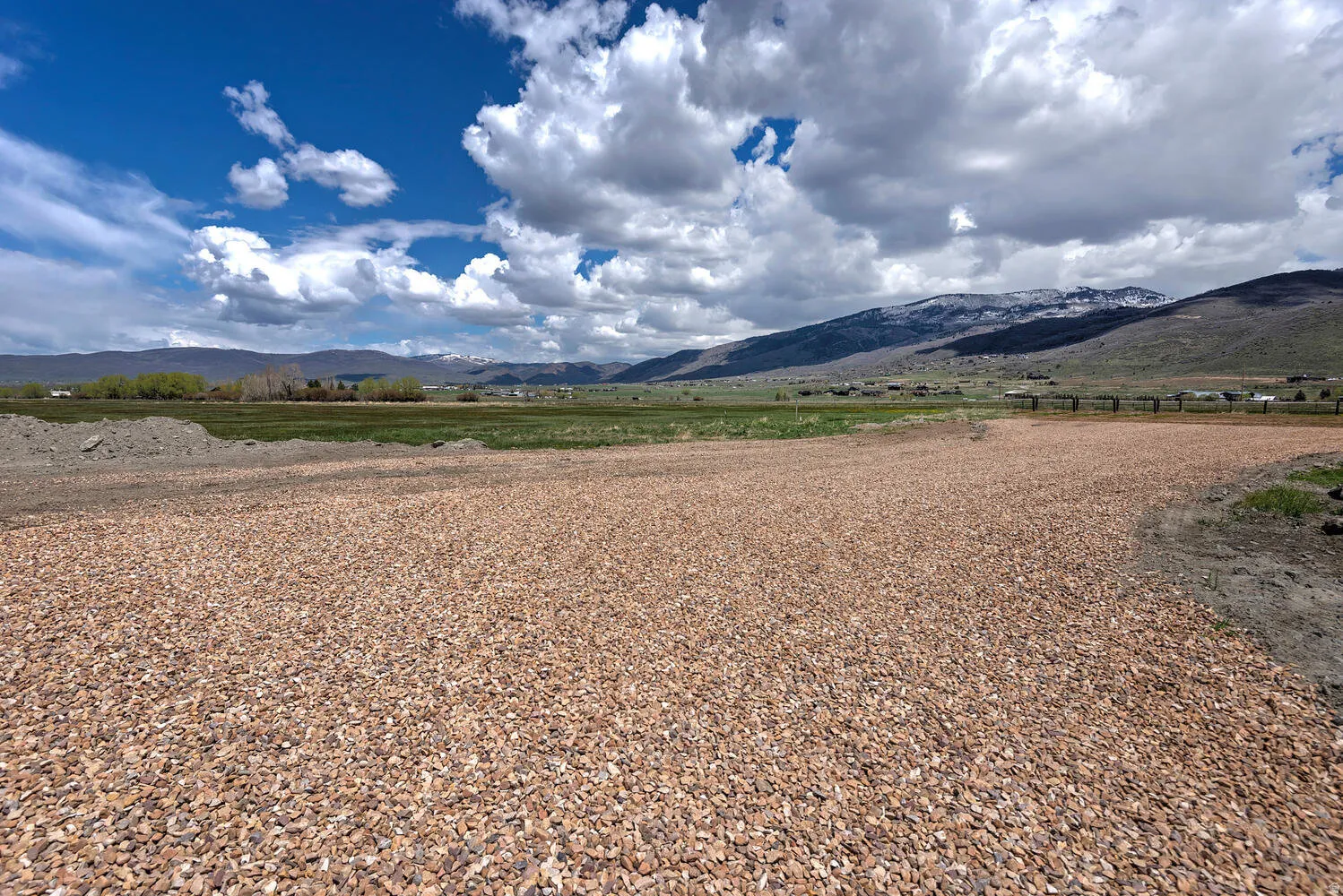 View of mountain background featuring rural landscape