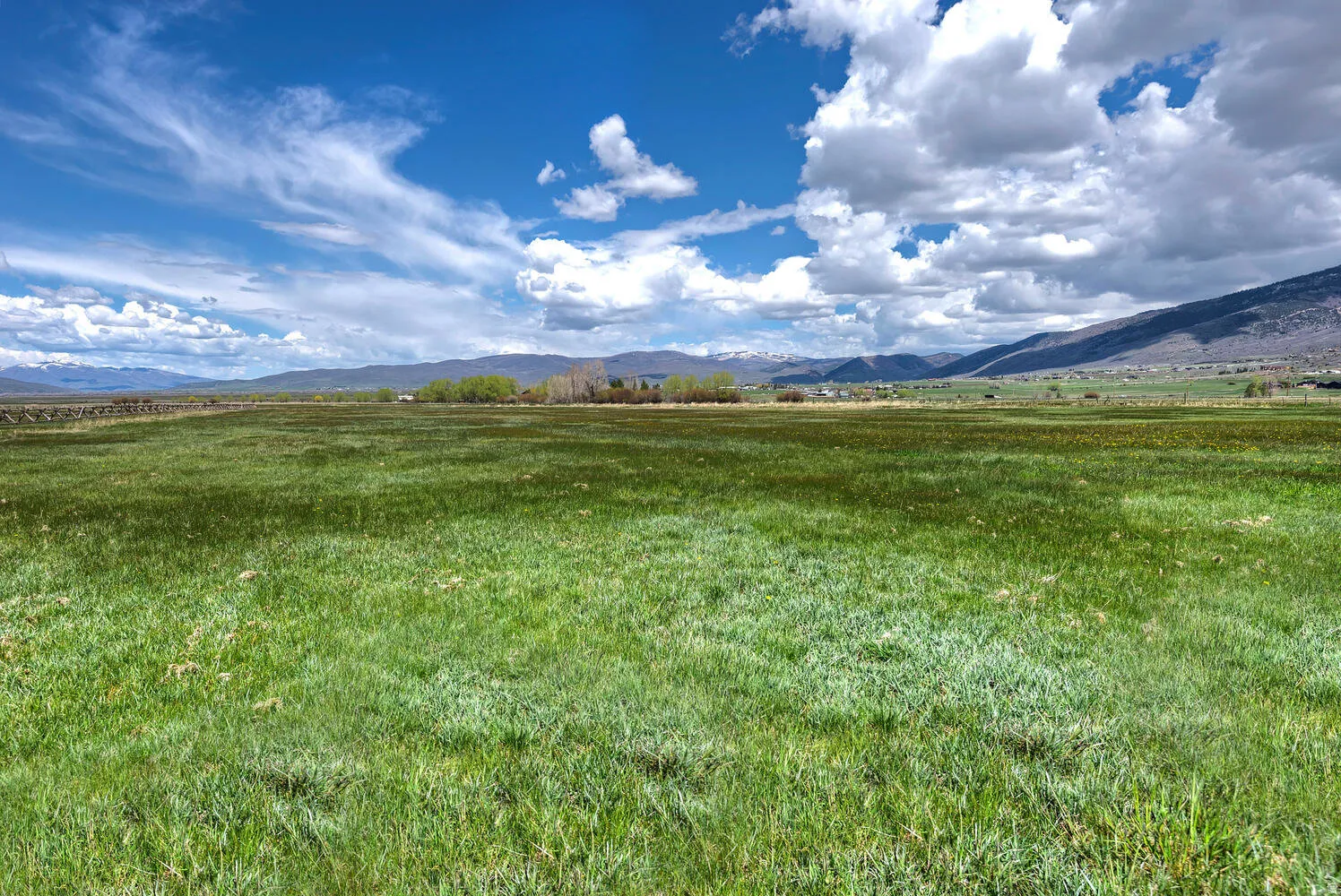 View of mountain background featuring rural landscape