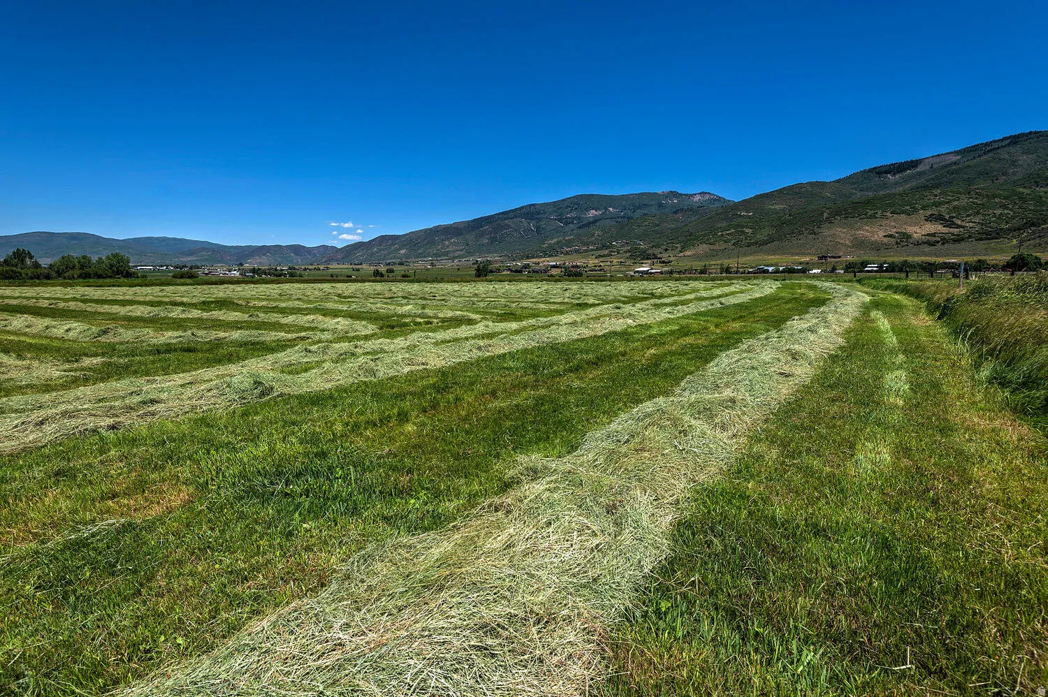 View of mountain background featuring rural landscape