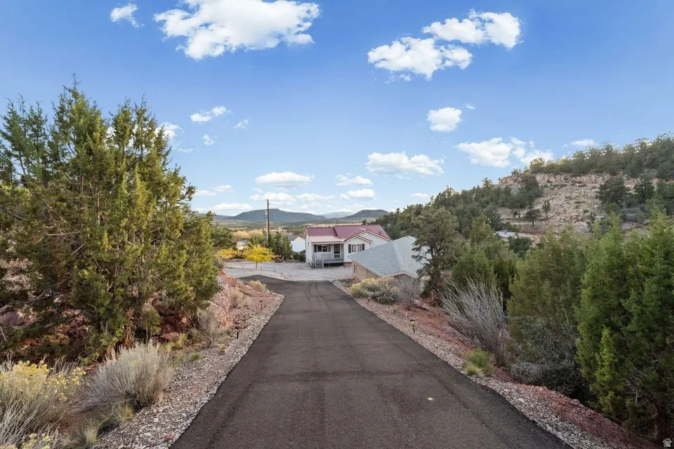 View of asphalt driveway featuring a mountain view