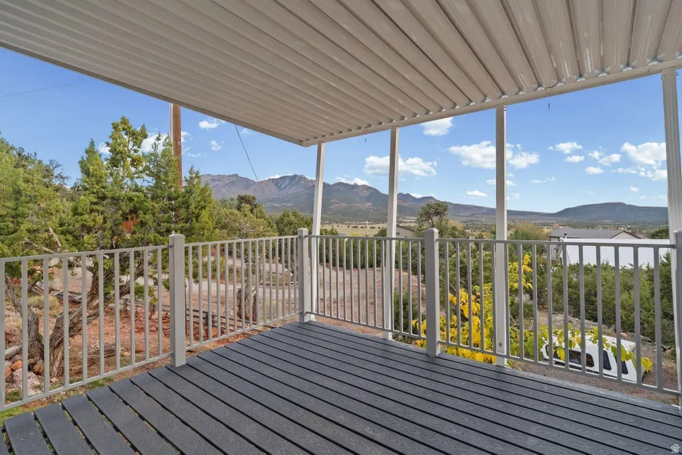 Wooden deck featuring a mountain view
